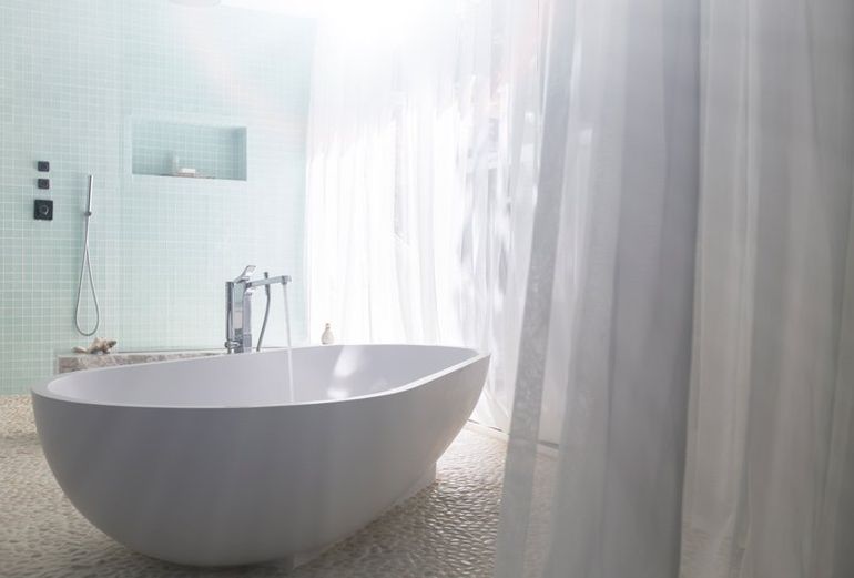 bathroom with white tub
