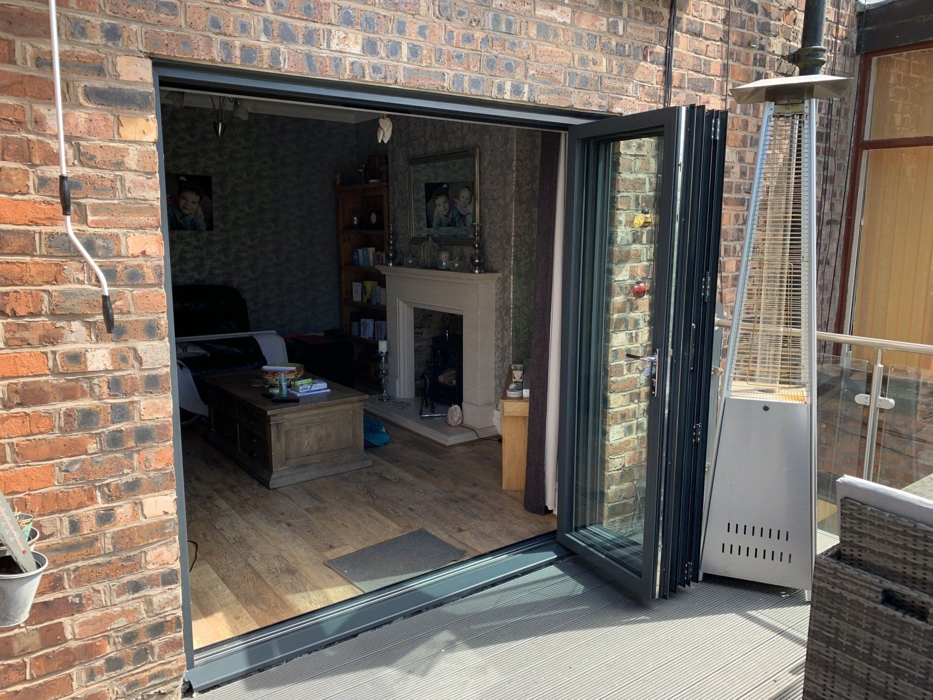 grey aluminium bifold doors installed in blackley manchester