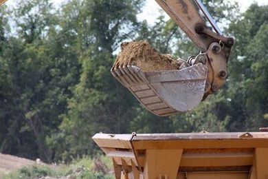 Excavator and Dumpster Truck — Excavation Company in New Bern, NC
