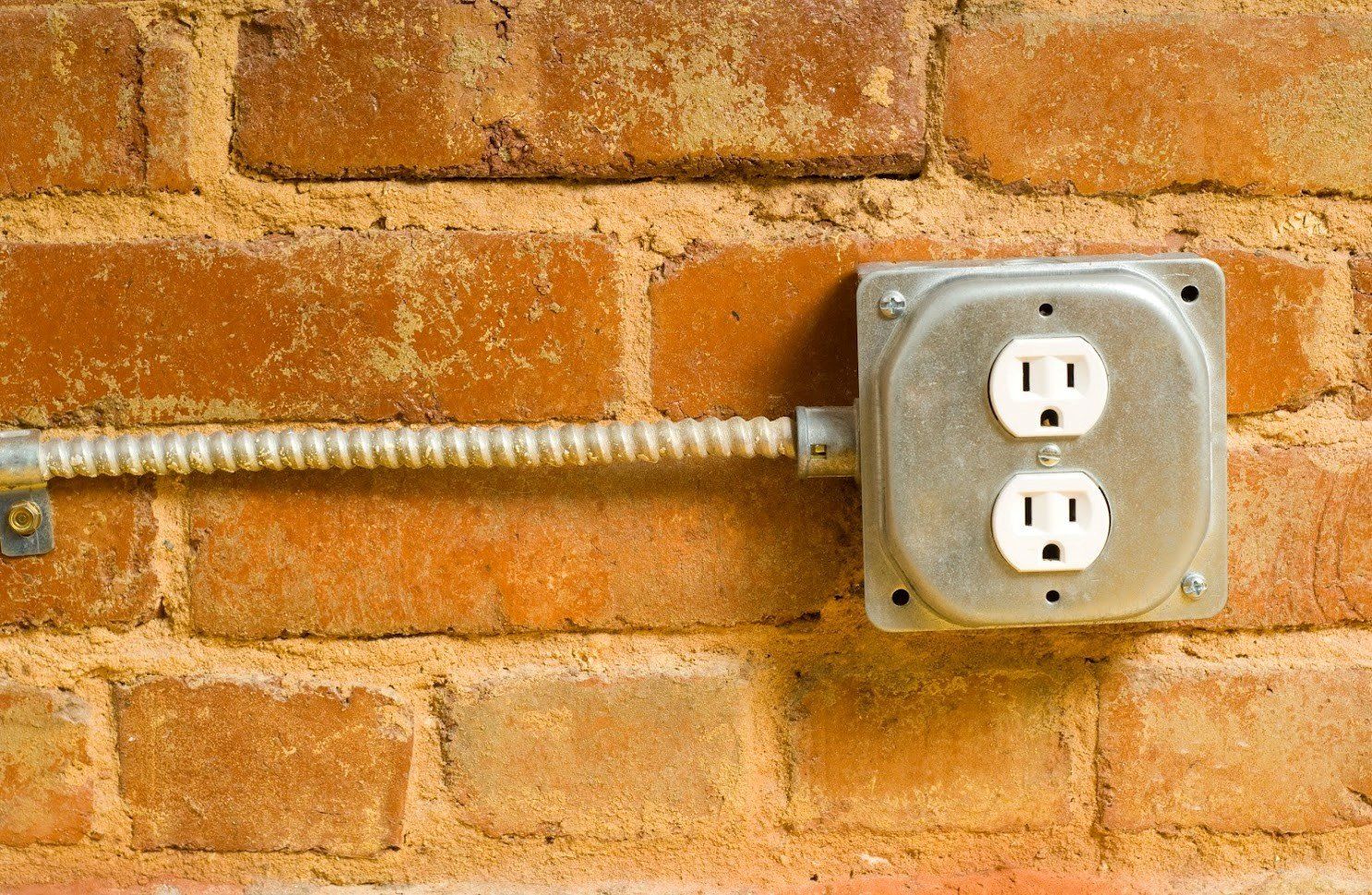 Electric Outlet on a Brick Wall — Richmond, VA — Beckstoffer Welsh Inc