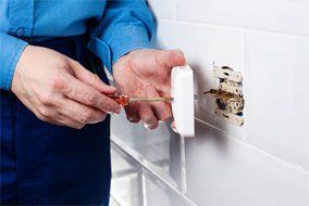 New electrical installation — Man Screwing Wires in Richmond, VA New electrical installation — Man Screwing Wires in Richmond, VA
