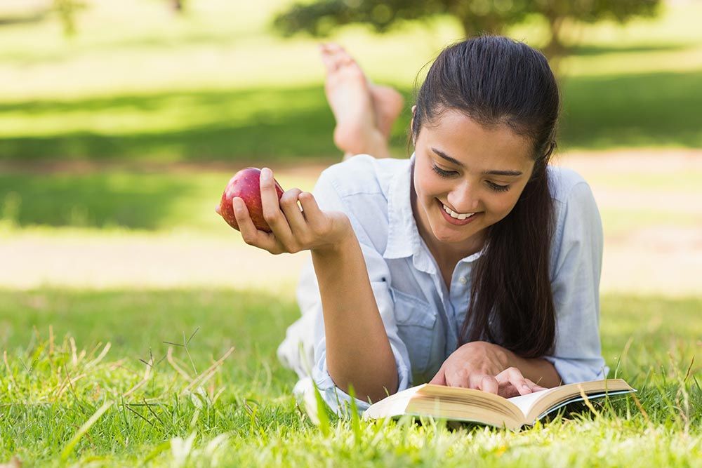 woman reading outdoors