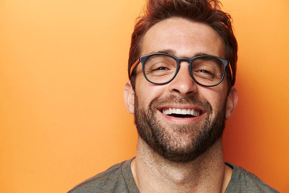 man against orange background