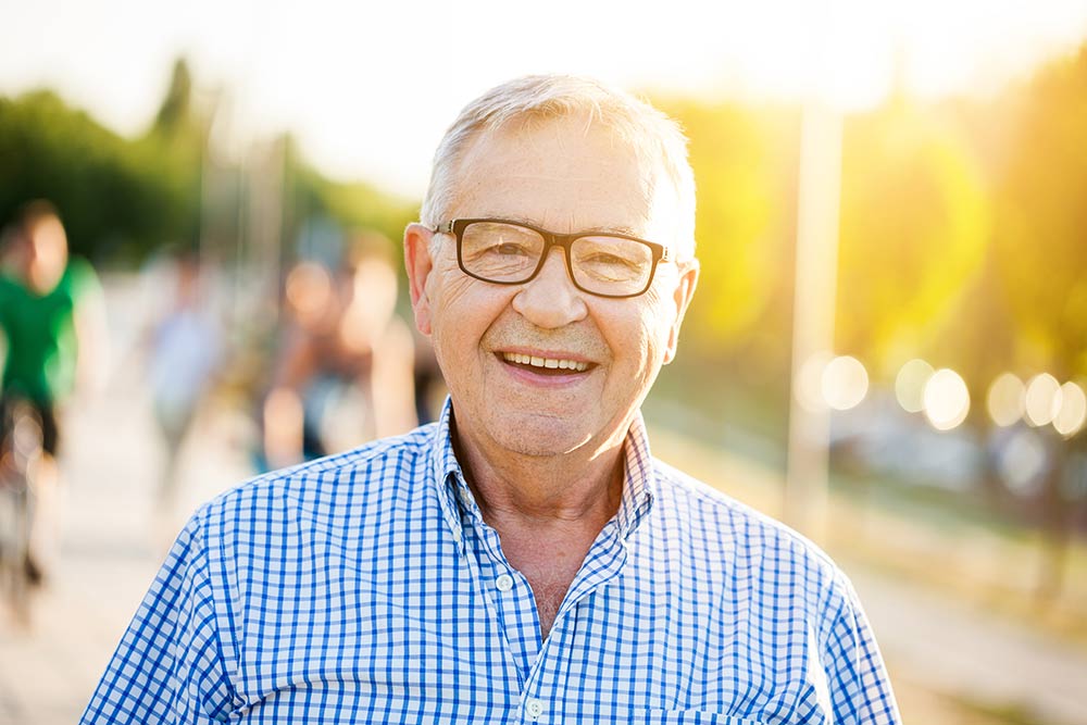 man smiling in public