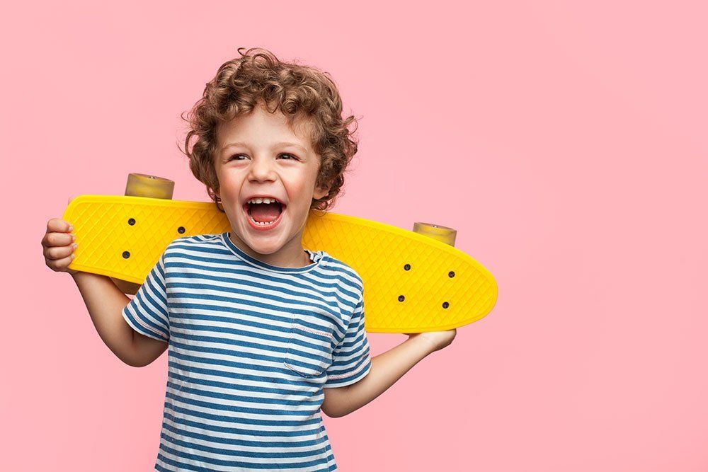 small boy with skateboard
