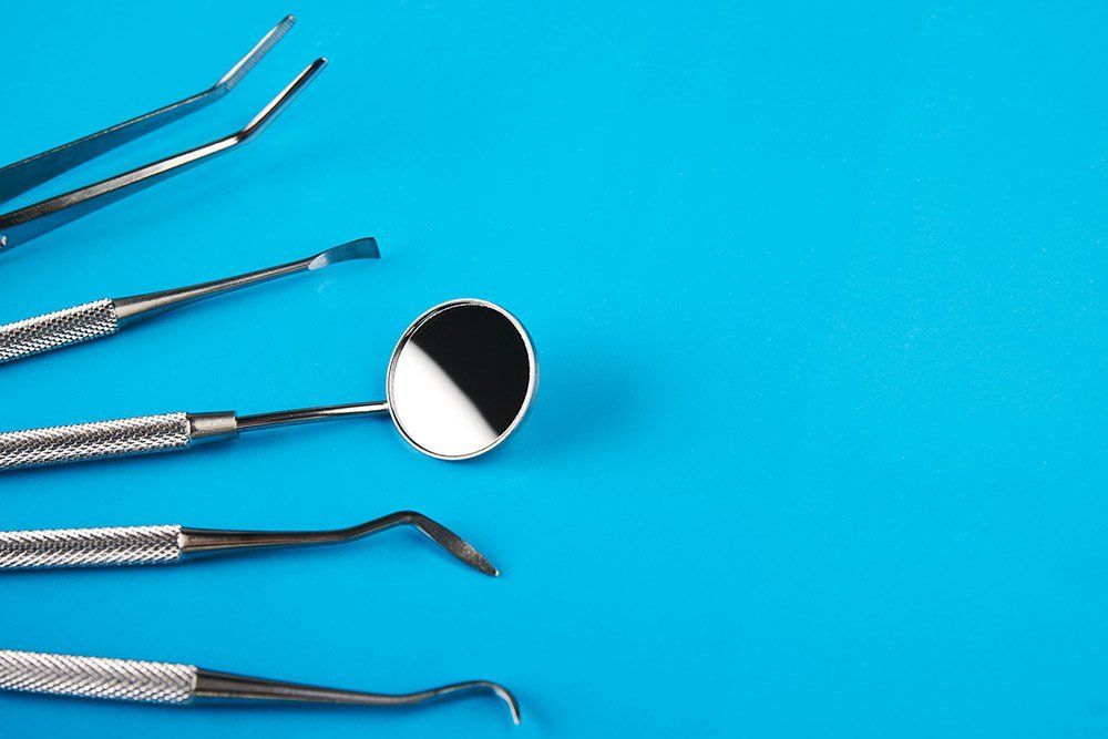 dental tools on blue background