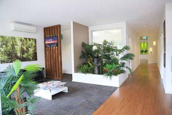 waiting room with carpet and wood floor