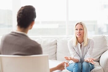 Woman Speaking to a Therapist — Behavioral Issues in Northbrook, IL Woman Speaking to a Therapist — Behavioral Issues in Northbrook, IL