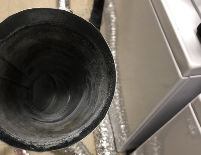 Dryer Vent Cleaning — Cleaning Aluminum Dryer Vent in Lapeer, MI