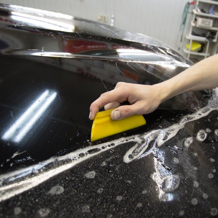 Close Up Photo Of Paint Protection Installation — Lombard, IL — X-Treme Graphics & Lettering Inc Close Up Photo Of Paint Protection Installation — Lombard, IL — X-Treme Graphics & Lettering Inc