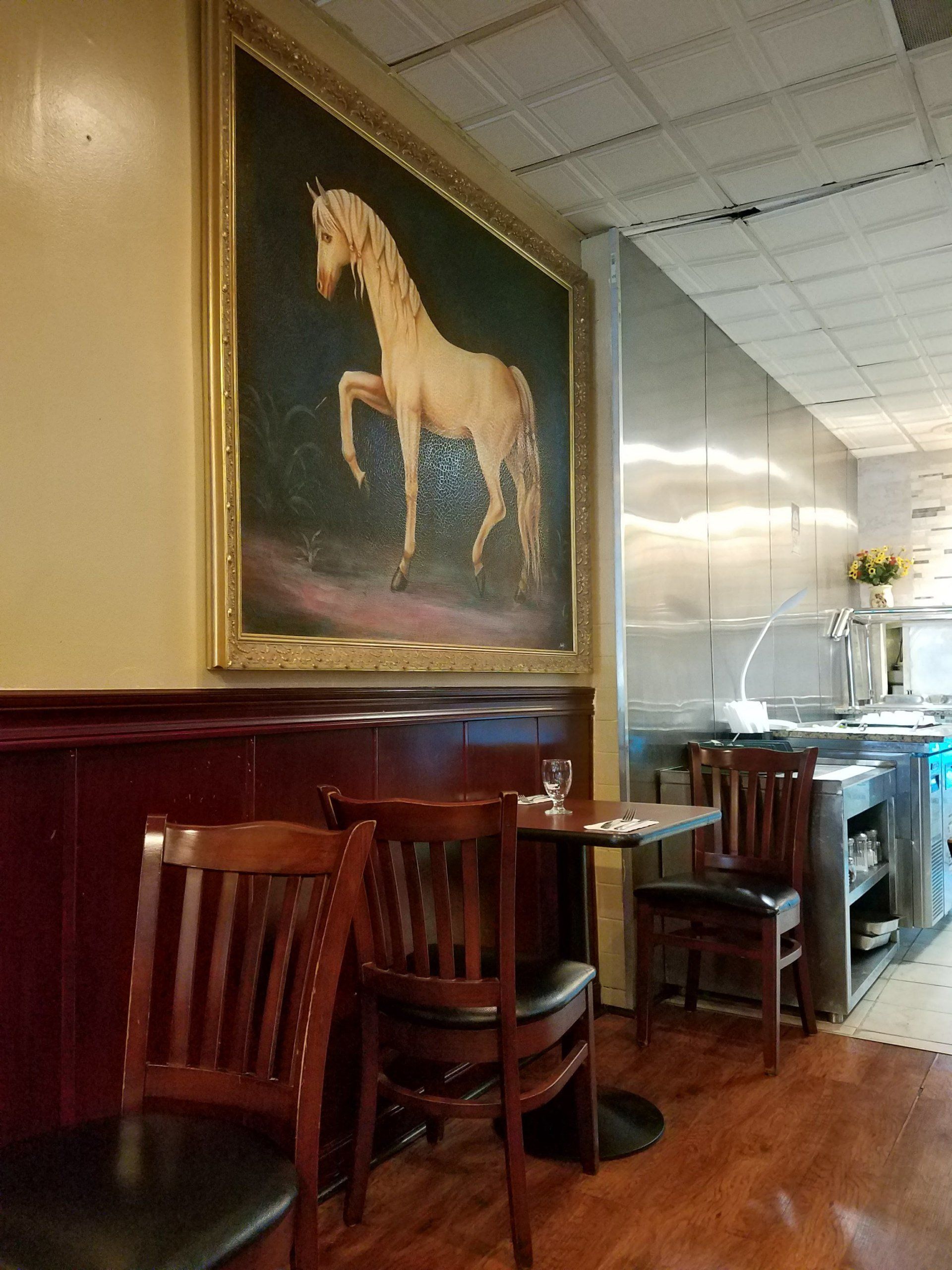 horse painting hanged in a bar by dismantlefurniture
