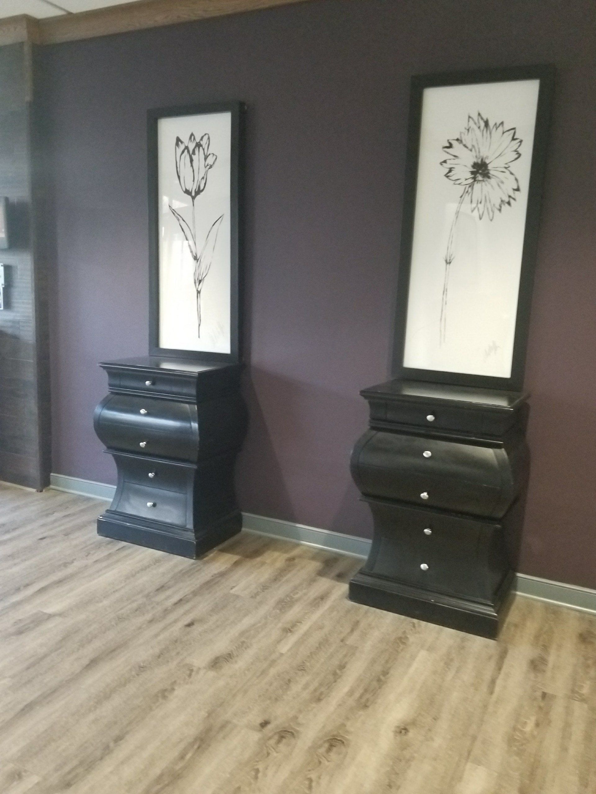 japanese style monochrome flowers of a rose and a daisy above a curvy nightstand by dismantle furniture