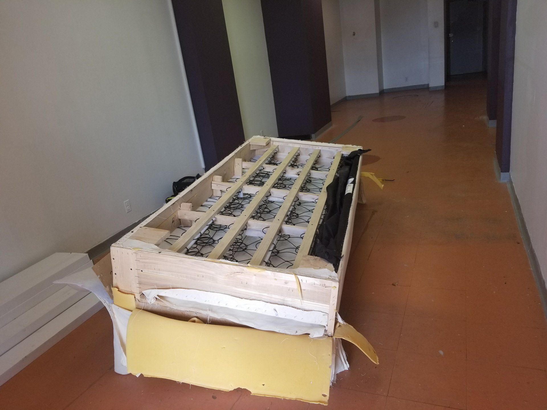 Disassembling a sofa to fit through door by dismantle furniture