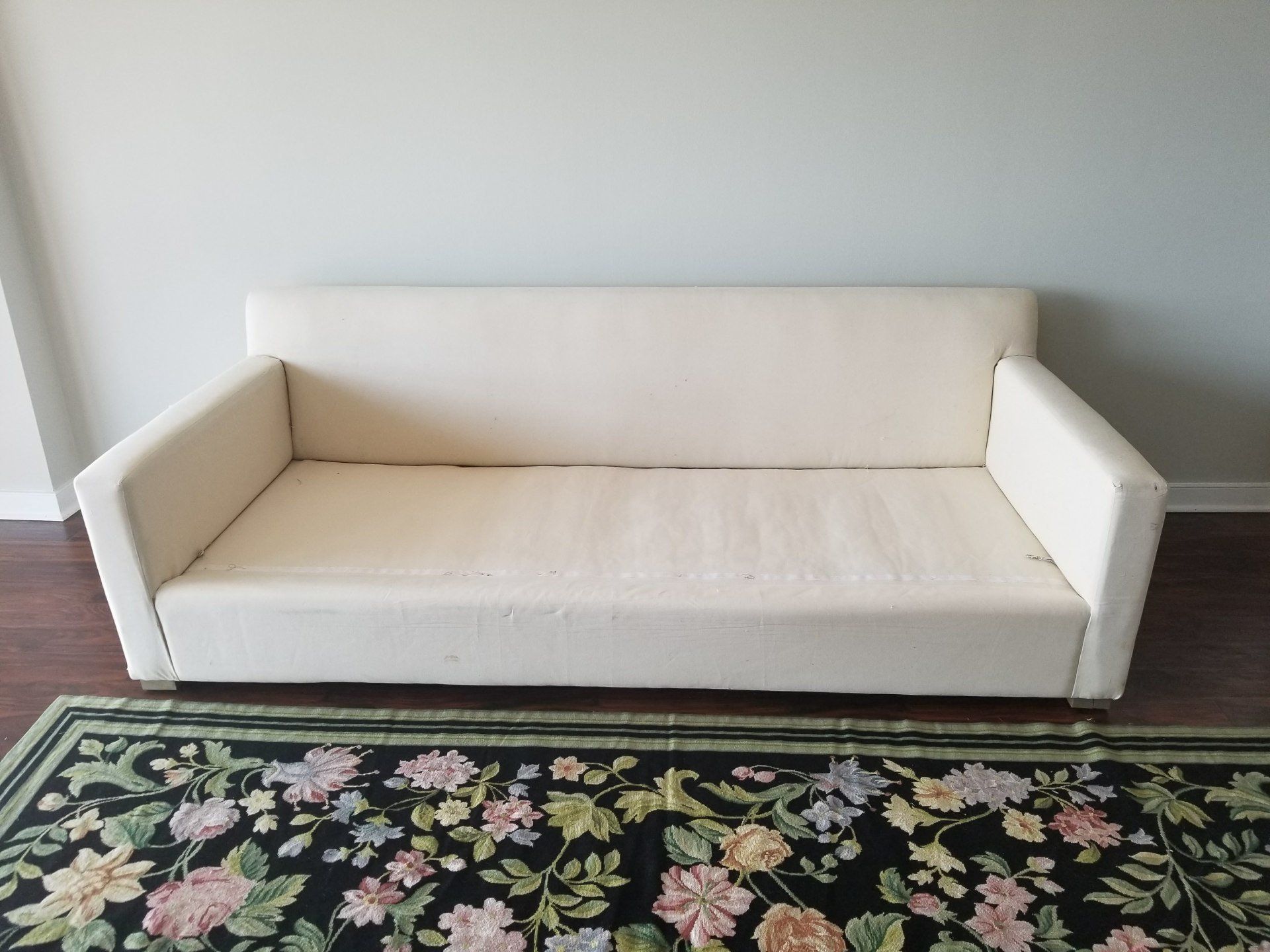 long white couch by dismantle furniture