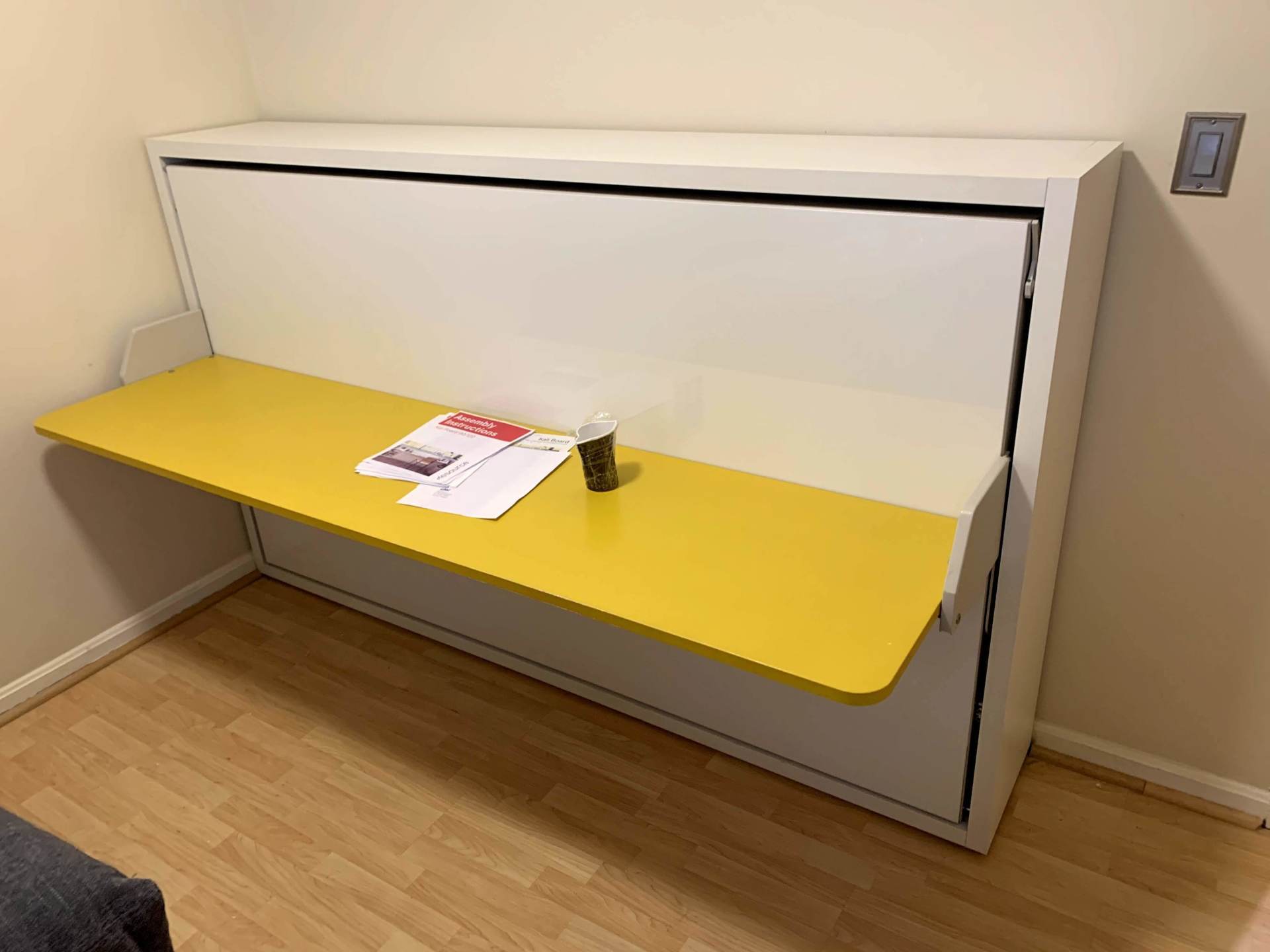 profile of assembled CLEI furniture yellow and white Murphy bed by furniture assembly team