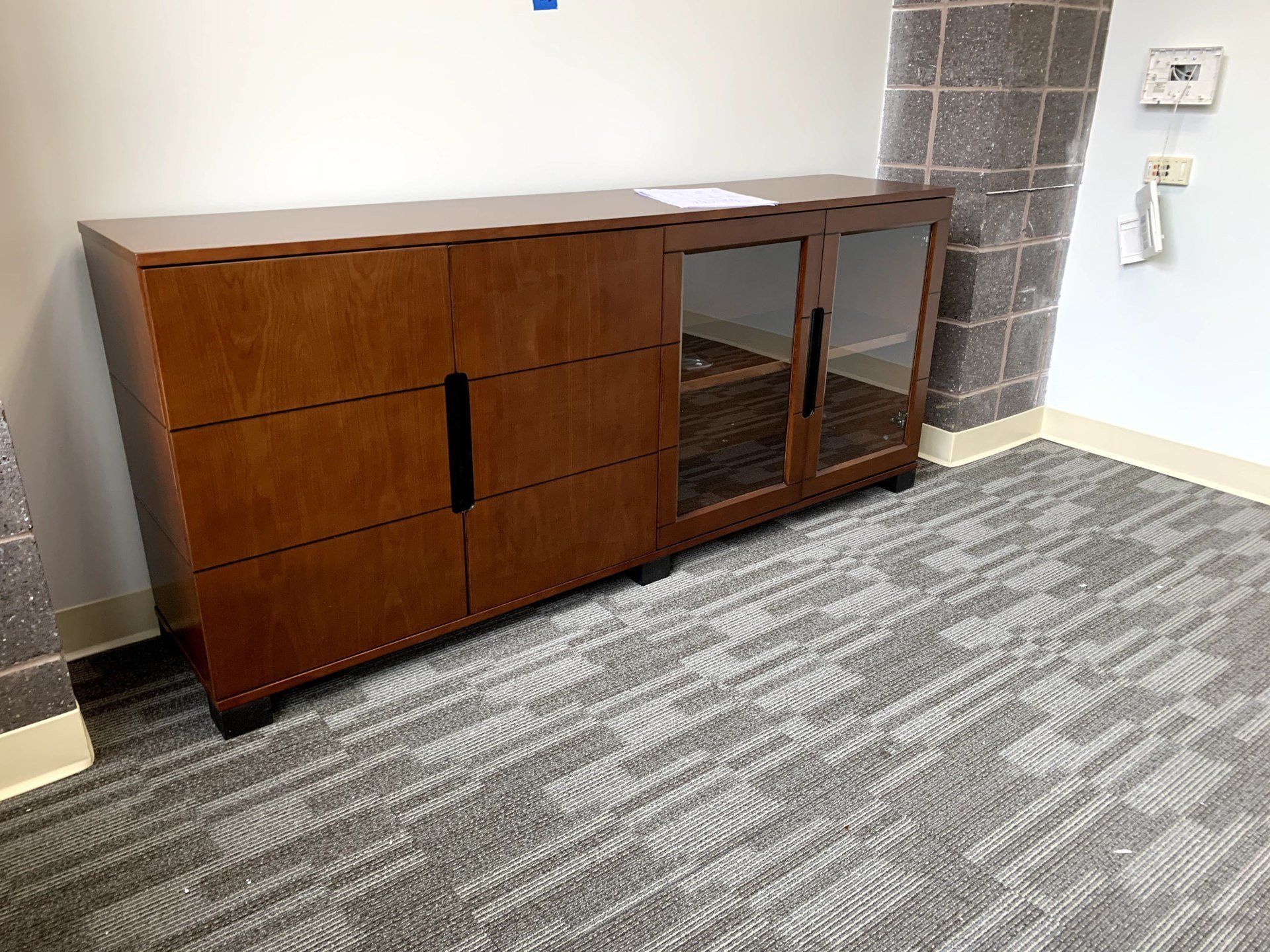 brown wood glass cabinet by furniture assembly team