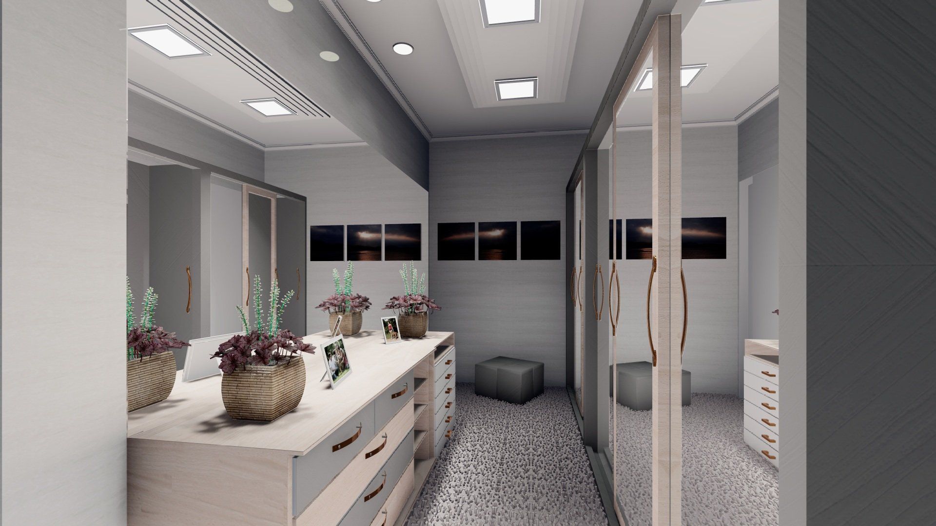 Walk-in closet with a long vanity, mirrored doors, and a gray and beige color scheme.