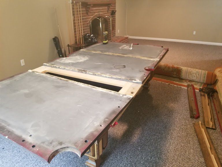 Pool table disassembly process by Dismantle Furniture Company