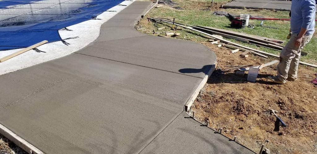 Sidewalk Building — Sidewalk Flooring Top Side View with a Man in Louisville, KY