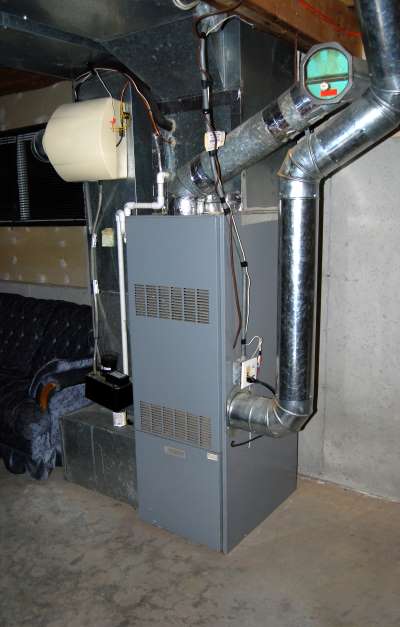 Heating and air furnace in a home basement.