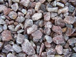 Close-up of small pink and gray rocks or gravel pieces.