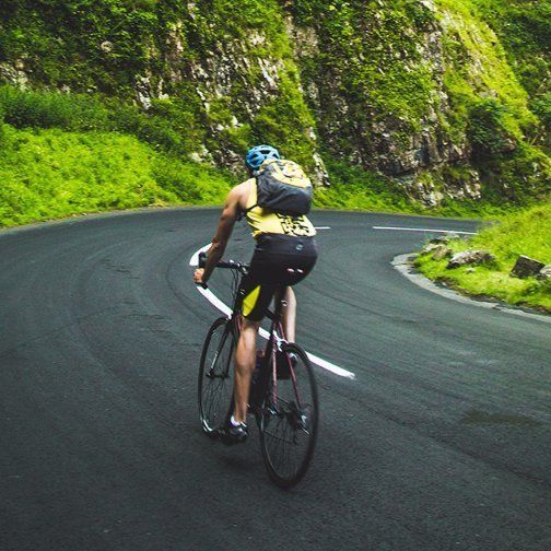 man on a racing bike on a country road