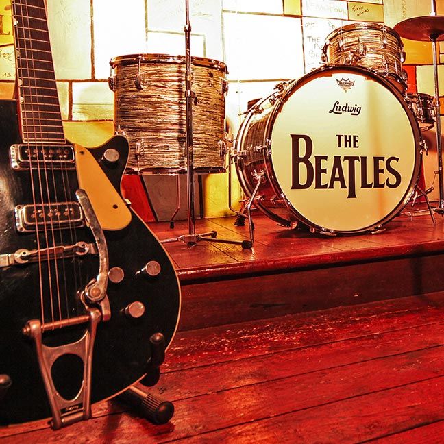 Drum kit with Beatles logo and guitar
