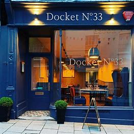 Glass fronted restaurant The Docket with blue painted wood work