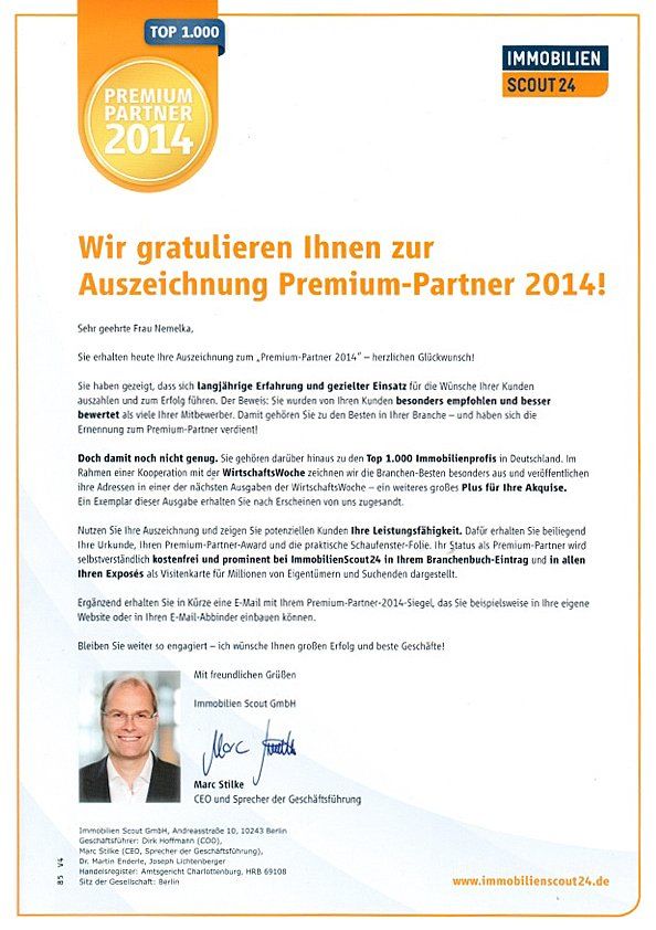 A white paper with a picture of a man and the words wir gratulieren ihnen zur auszeichnung premium-partner 2014