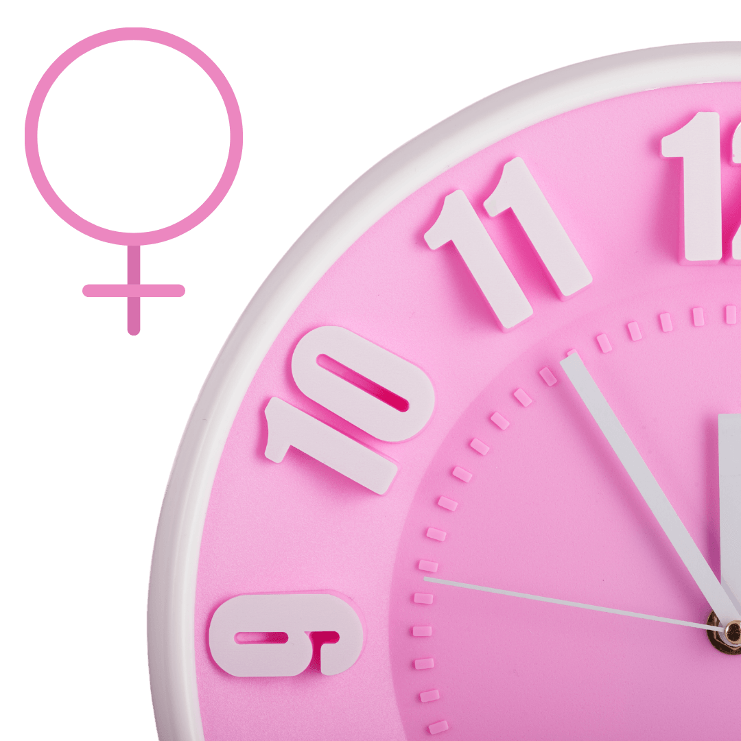 Pink clock face with white numbers and a female symbol icon on the left side