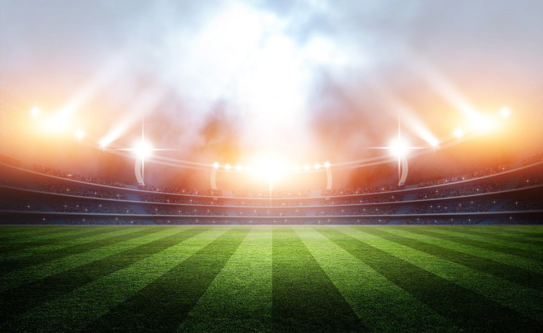 Hearing for Divorce Case — Omaha, NE — April Cover Attorney At Law Illuminated stadium with a green grass field, ready for a match.