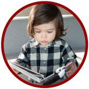 little long haired boy reading a book