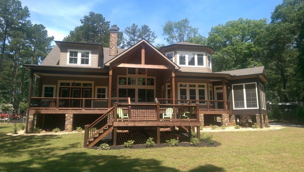 Lincolnton lakehouse with dark bronze accent gutters