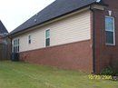 Appling home with black gutters view 3