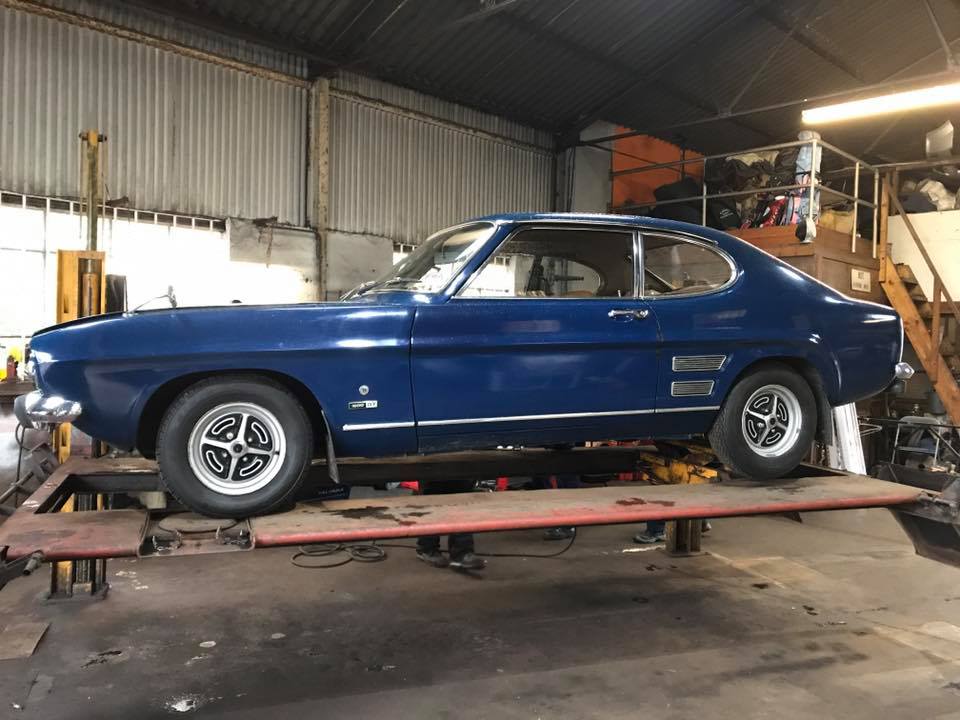 A car being lifted for service