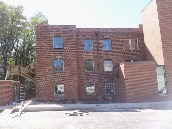 A large brick building with a lot of windows