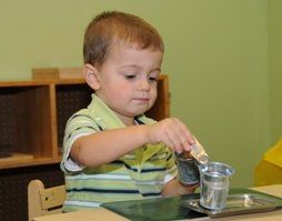 A preschool student doing an activity