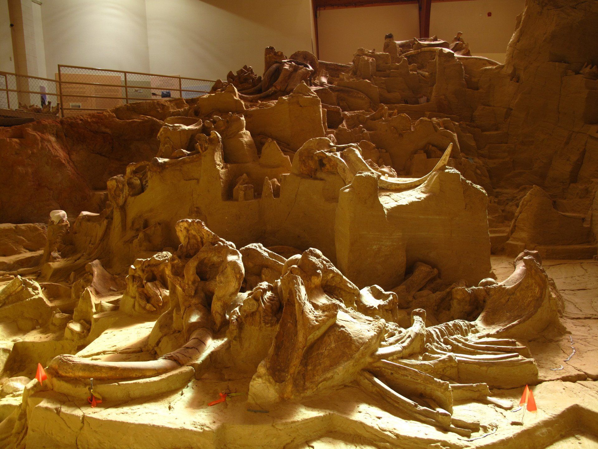 A large pile of clay sculptures in a room
