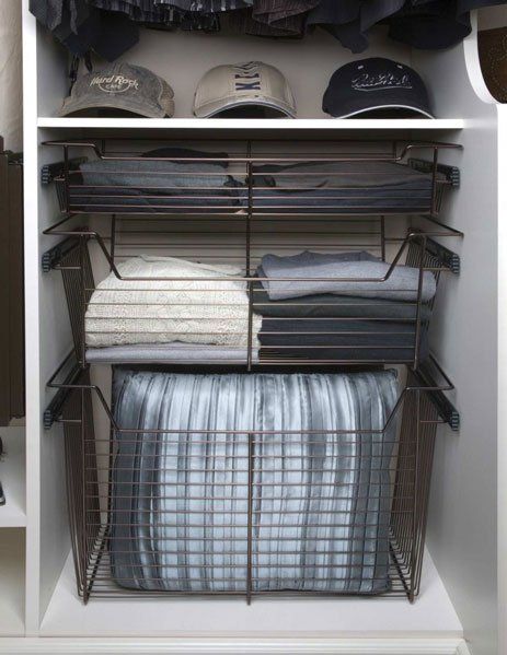 A closet filled with clothes and hats and a basket