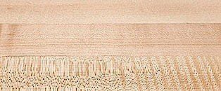 A close up of a piece of wood with a pattern on it.