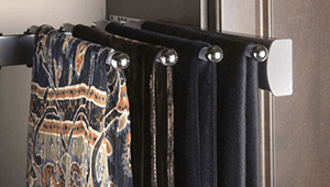 A bunch of scarves are hanging on a rack