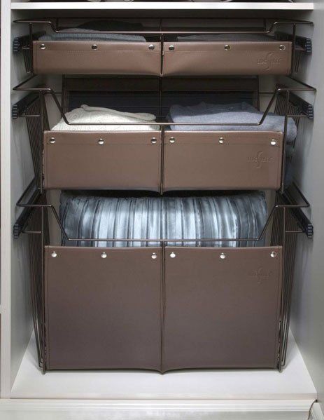 A closet filled with lots of clothes and drawers.