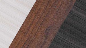 A close up of a piece of wood between two different types of wood.