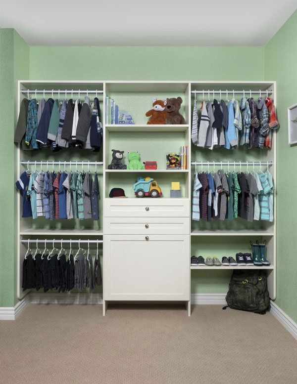 A child 's closet with lots of clothes and toys