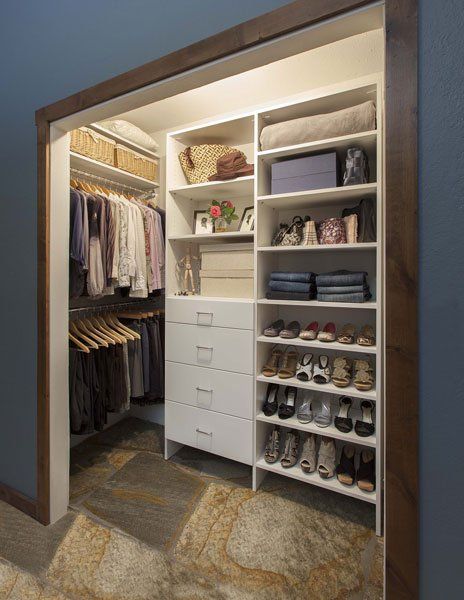 A walk in closet filled with clothes and shoes