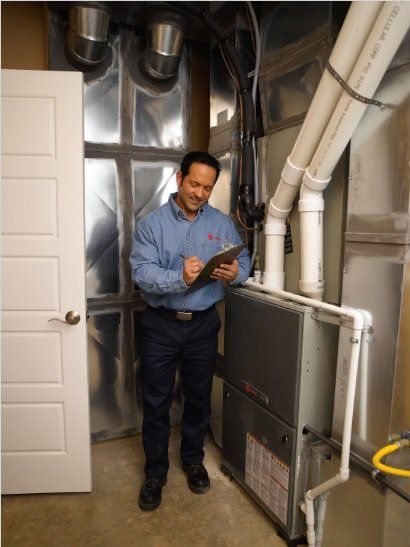 Furnace Repair Expert — Man Checking Furnace Status in Hickory, NC