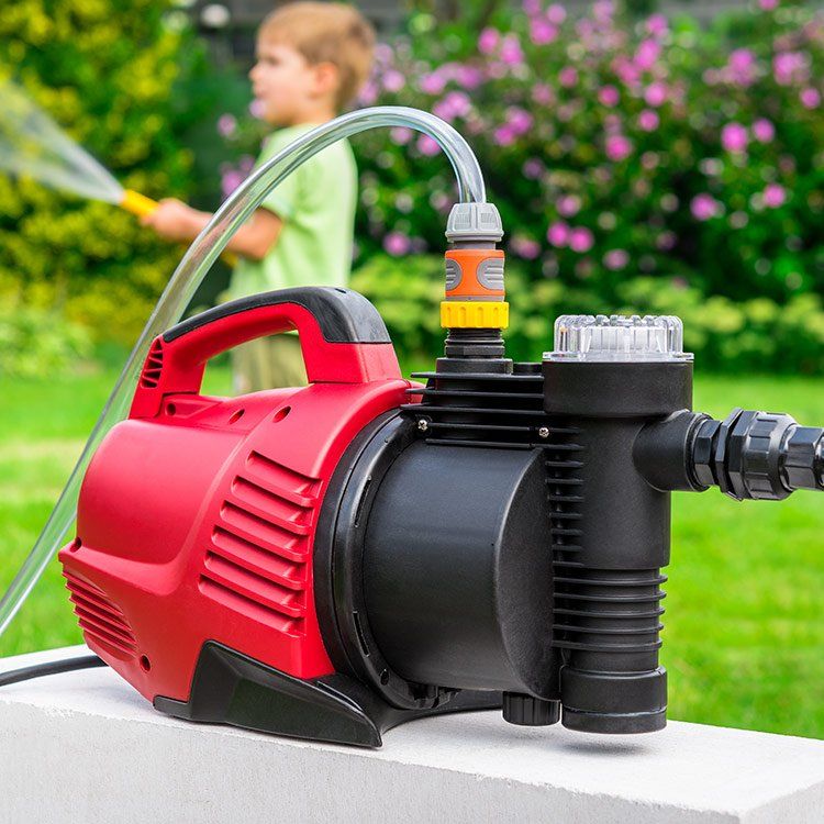Modern Water Pump In The Garden — Water Pumps In Bowen, QLD
