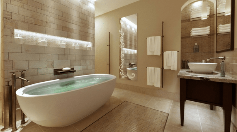 Dark marble wall and floor tiles surrounding a bathtub