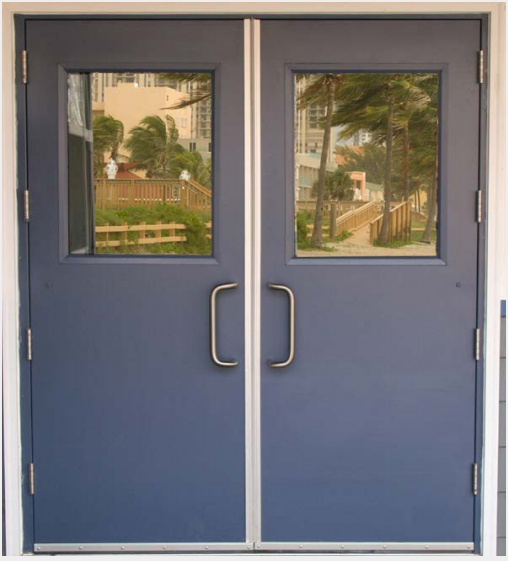 A pair of blue doors with two windows and handles