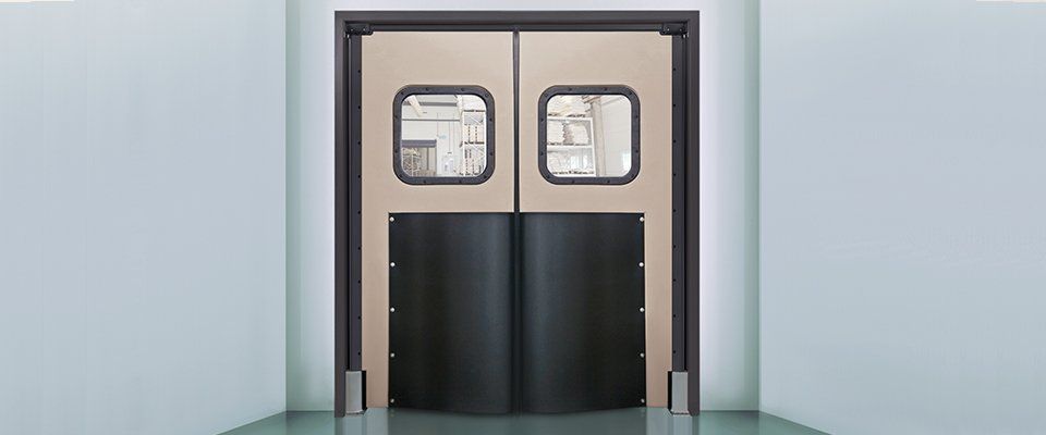 A pair of sliding doors with windows in a room.